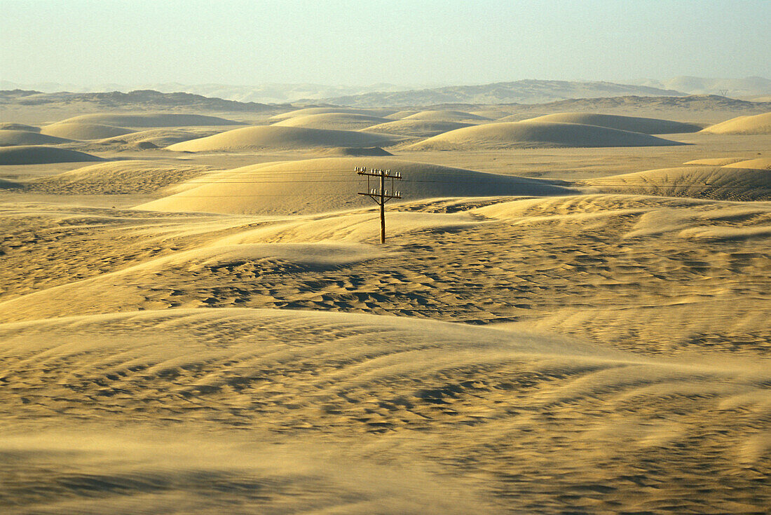 Electric pylon in the middle of the desert, Luederitz, Namibia, Africa