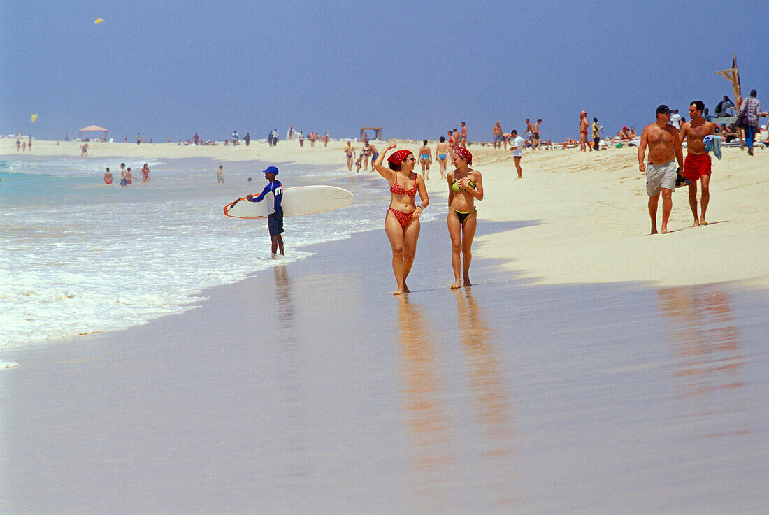 Two woman walking along the beach, Santa Maria, Sal, Cape Verde, Africa