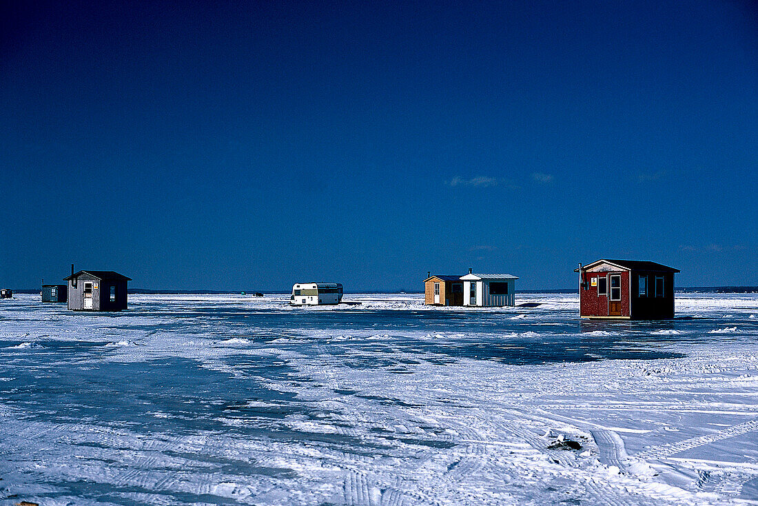 Ice Fishing, Cottages, St. Lawrence River, Winter Prov. Quebec, Canada