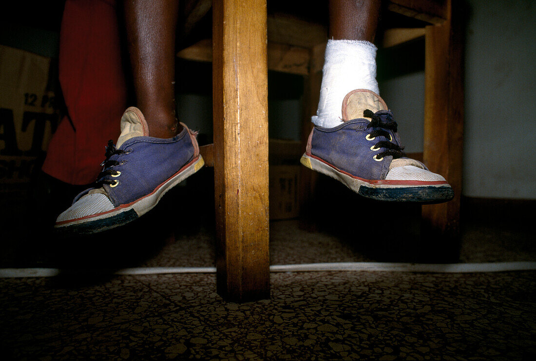 Ankle with bandage, feet of a patient, relief project 'Portland Medical Care', Jamaica