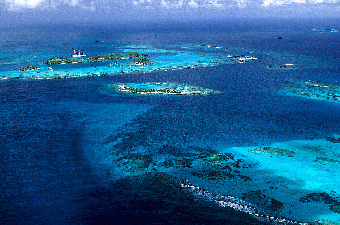 Aerial view of the archipelago Tobago Cays under clouded sky, Grenadines, Caribbean, America