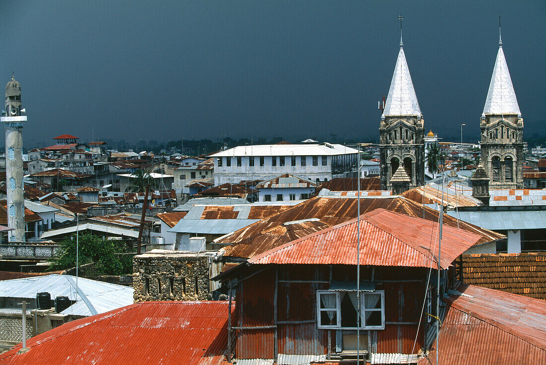 View at roofs and the towers of the cathedral at a stormy atmosphere, Stone Town, Zanzibar, Tanzania, Africa