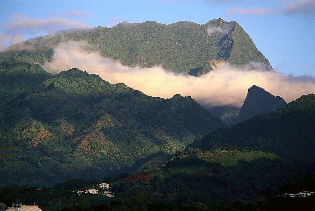 Mountain peaks above clouds in the sunlight, Tahiti, French Polynesia, Oceania