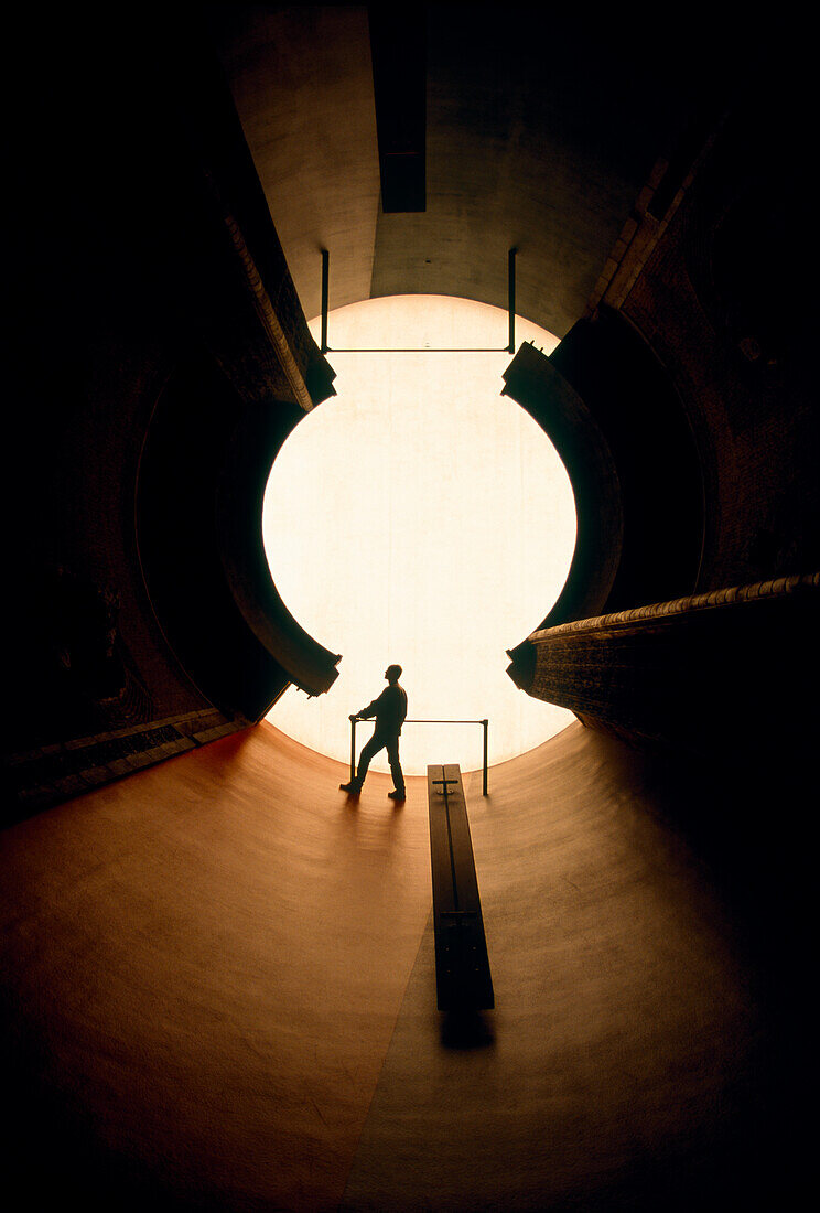 A person in the sun room at the Museum of Contemporary Art, Nagi, Japan