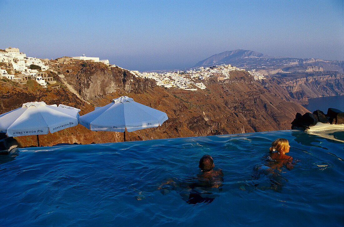 People at the pool of the hotel Petra Honeymoon Villas, Imerovigli, Santorin, Cyclades, Greece, Europe