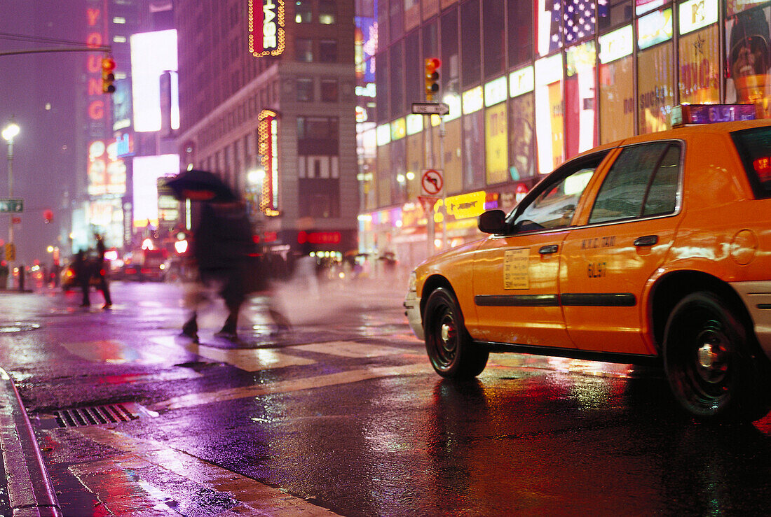 Taxi and people in the rain at night, Times Square, Manhattan, New York, USA, America