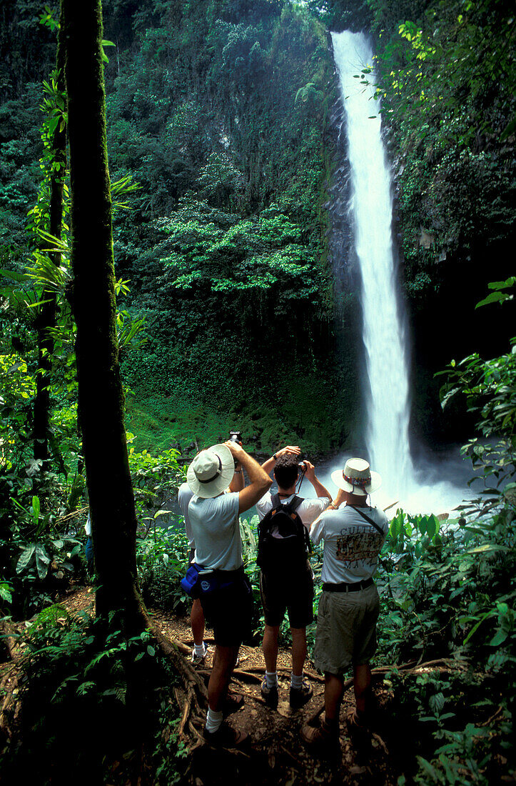 People making pictures of waterfall, Costa Rica, Caribbean, Central America