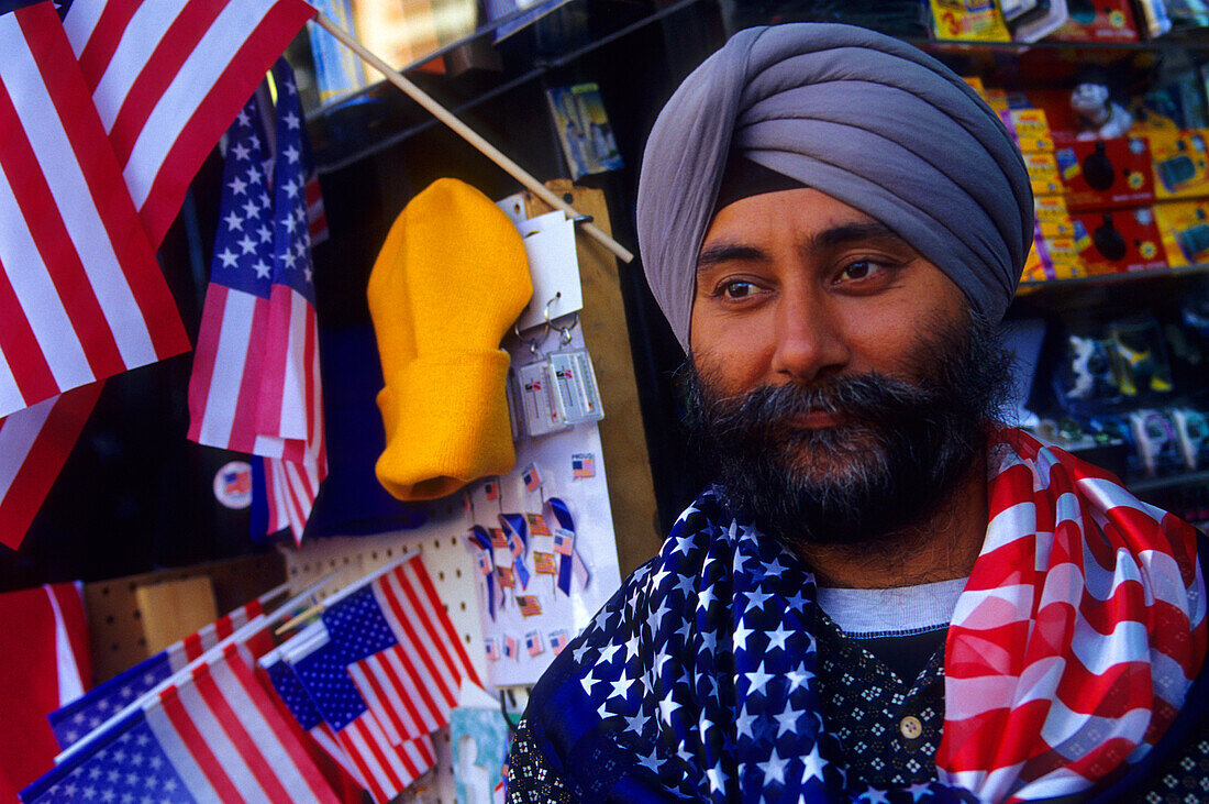 Indian salesman selling souvenirs, Manhattan, New York City, New York, USA