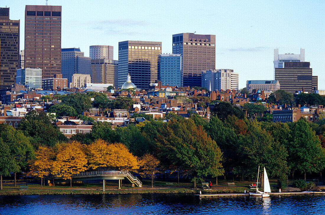 Sailing boat on Charles River in front of high rise buildings, Boston, Massachusetts, USA, America