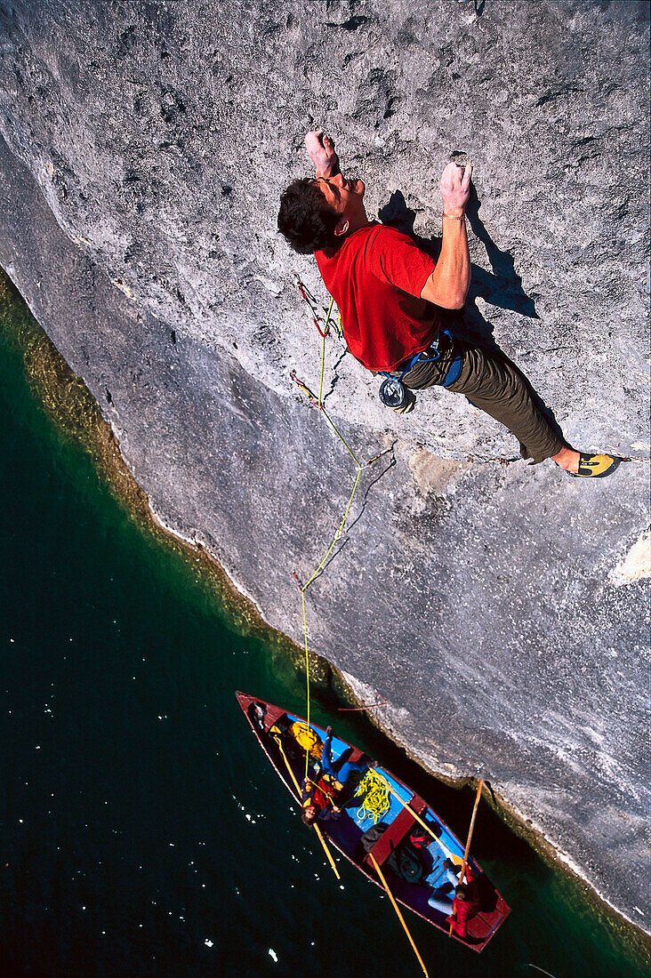 Free Climbing on Rock Face above Lake Wolfgangsee, Austria