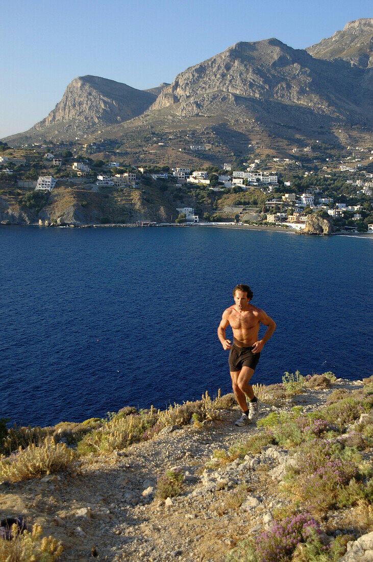 Jogging on cliff line of Kalymnos, Kalymnos, Greece