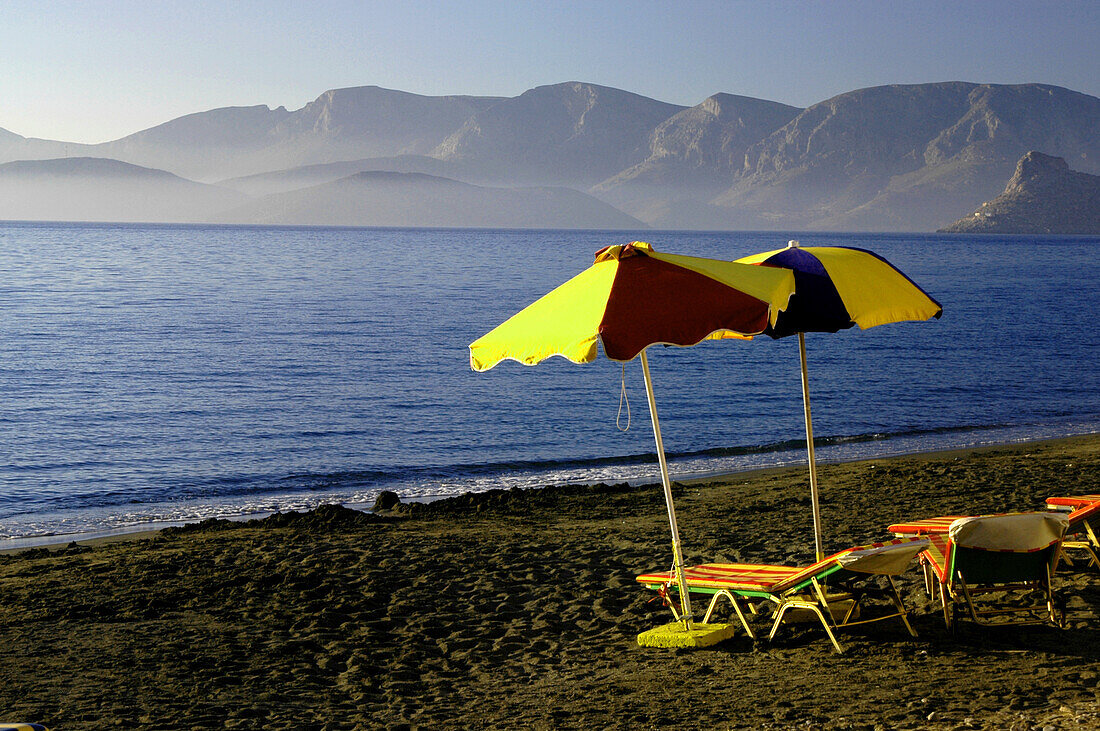 Sunshades on beach of Massouri, Kalymnos, Greece