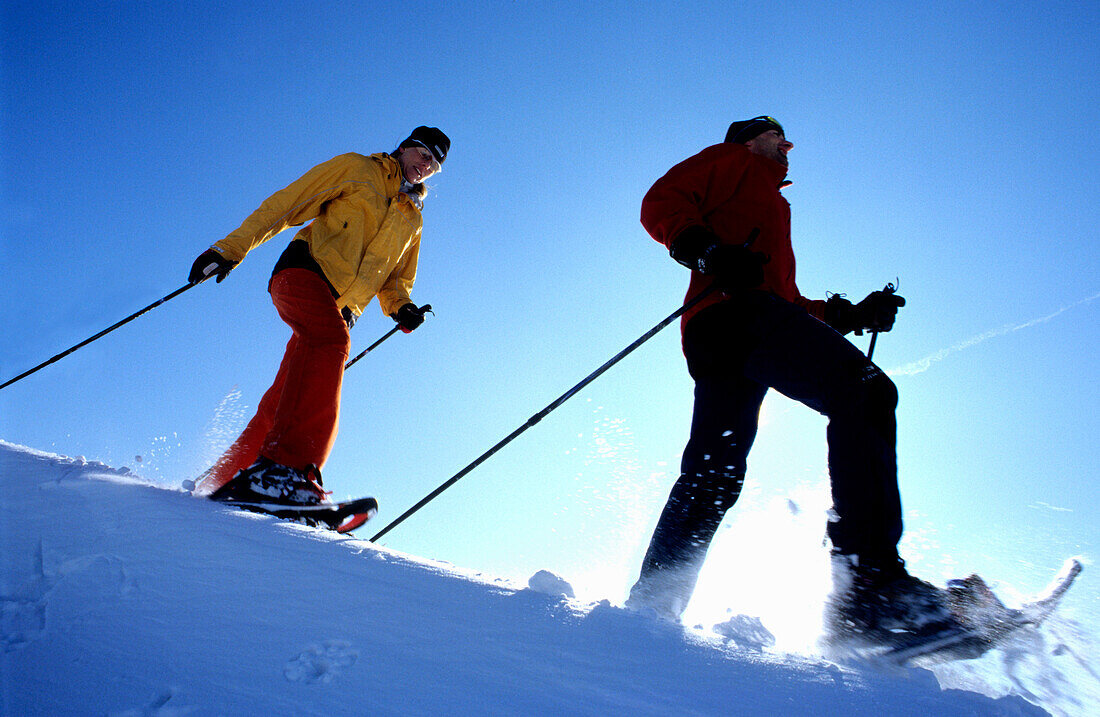 Couple of snowshoers on ridge, Muehlviertel, Upper Austria