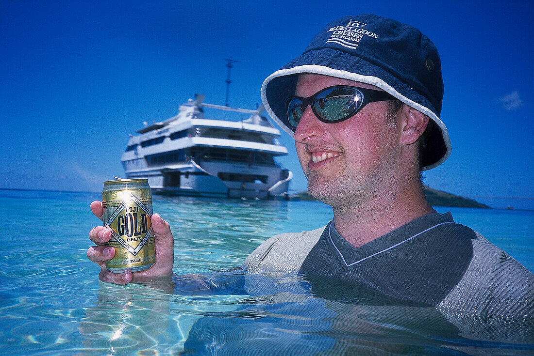 Man with Fiji Gold Beer, Blue Lagoon Cruise Nanuya Lailai Island, Fiji