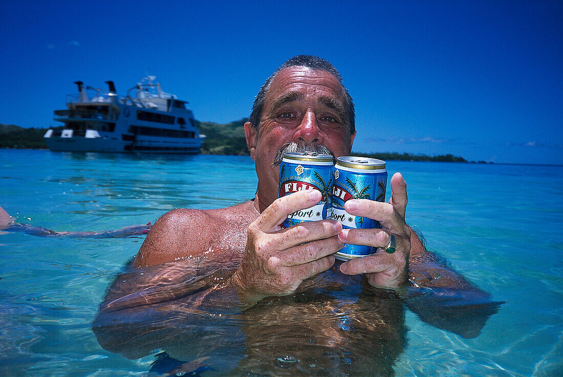 Man with Fiji Export Beer, Blue Lagoon Cruise Nanuya Lailai Island, Fiji