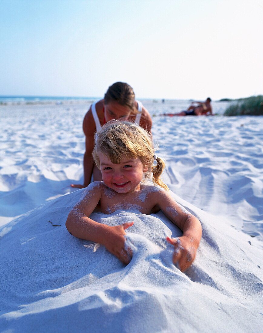 Playing on the beach, South coast of Bornholm, Denmark Baltic Sea