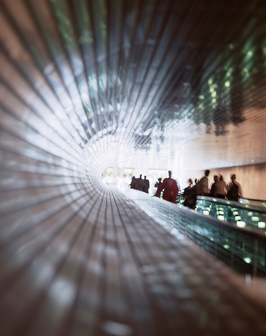 People on an escalator at the National Gallery, Washington D.C., USA, America