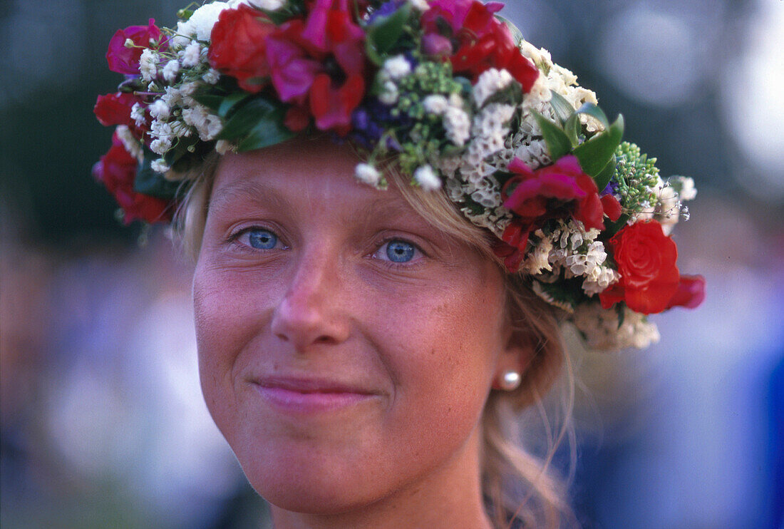 Young woman with floral wreath, Visby, Gotland, Sweden, Europe