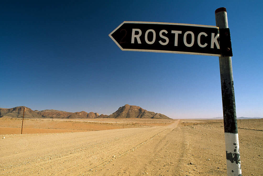 Farm signpost on a dirt road near Gaub Pass, on the edge of the Namib Naukluft National Park, Namibia
