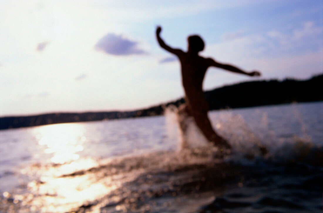 Mann running in lake