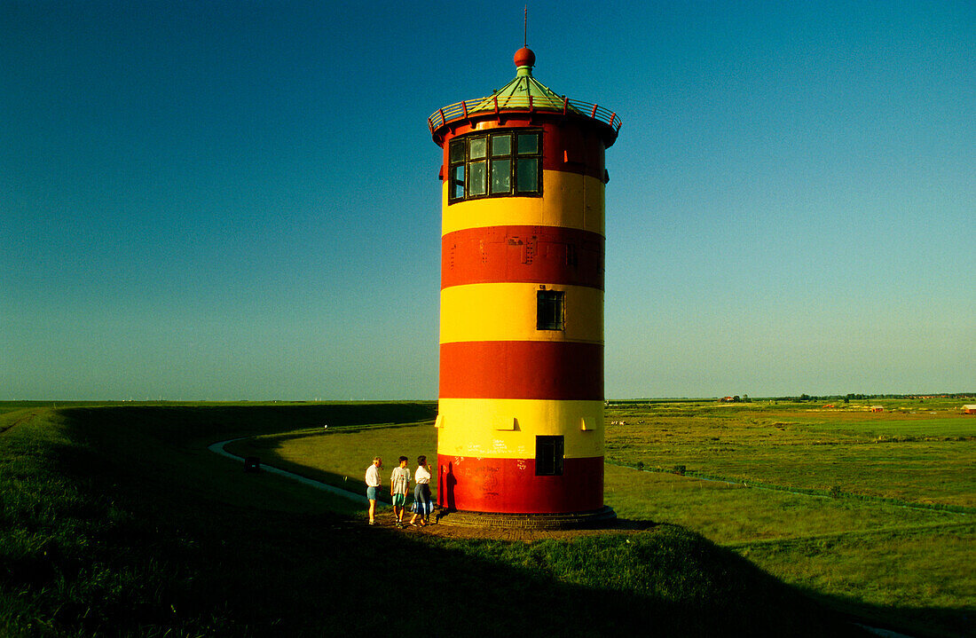 Lighthouse on dyke near Pilsum, East Frisia, Lower Saxony, Germany