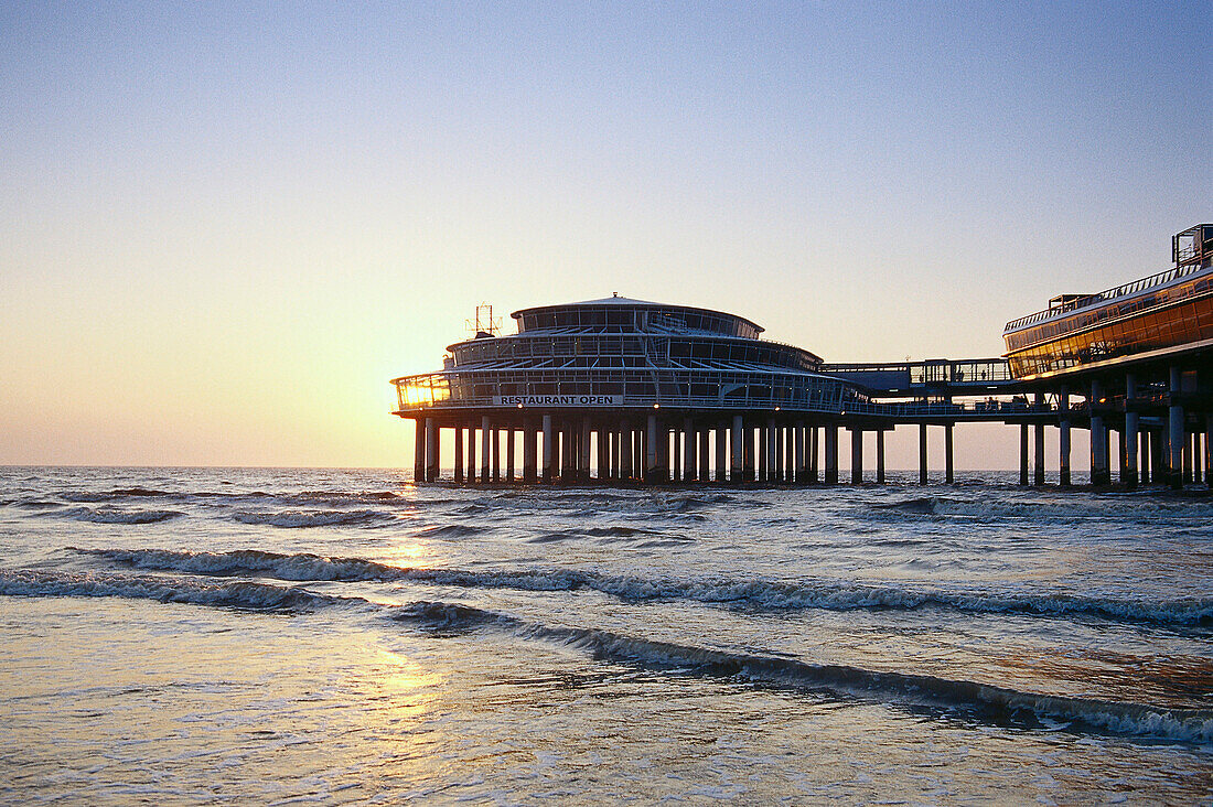 Sea brigdge in the sunset in Scheveningen. Netherlands