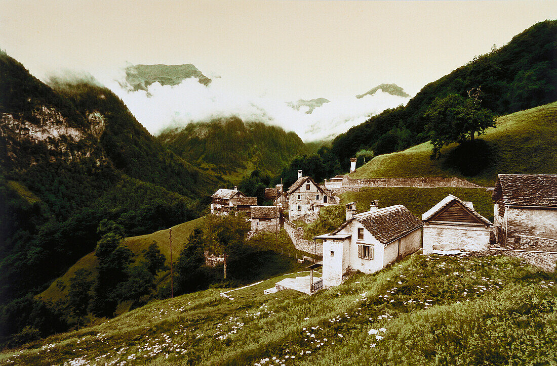 A mountain village with typical stone houses and mountain scenery, Val di Bosco, Ticino, Switzerland