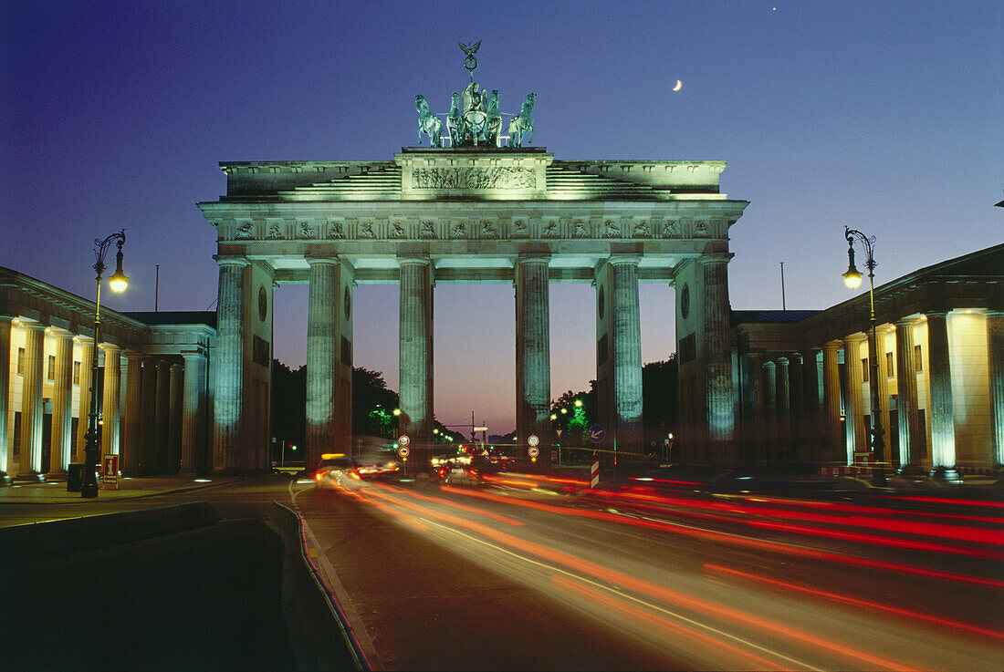 Luminous tracks through Brandenburg Gate, Berlin