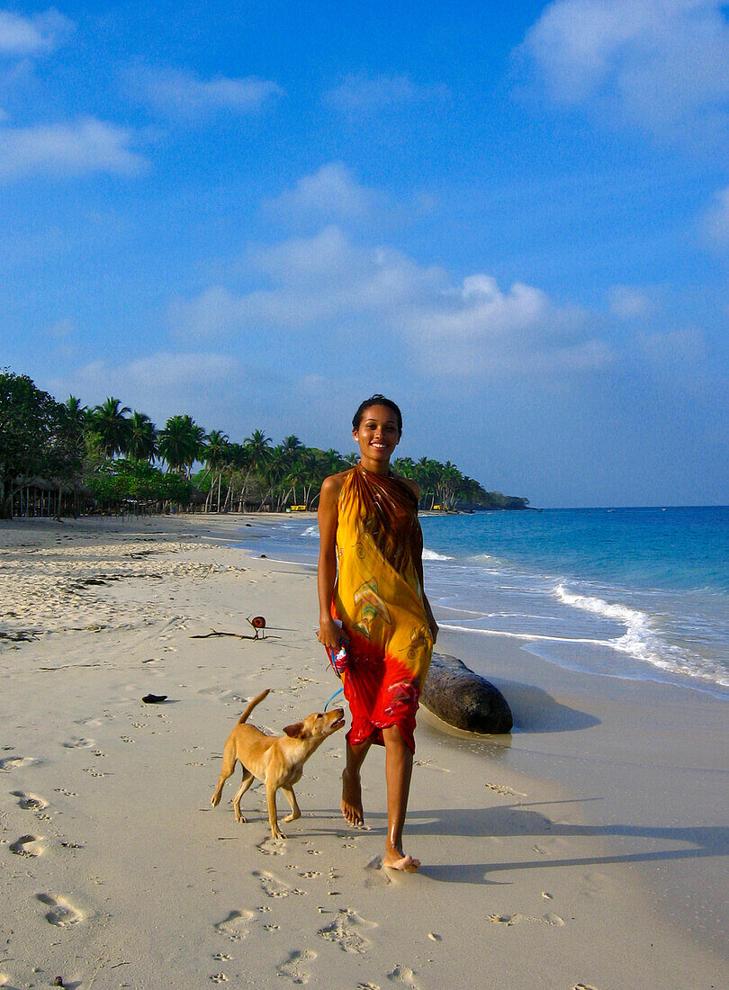 Girl and Dog walking on the Beach, Carribbean Beach, Cartagena, Colombia, South America