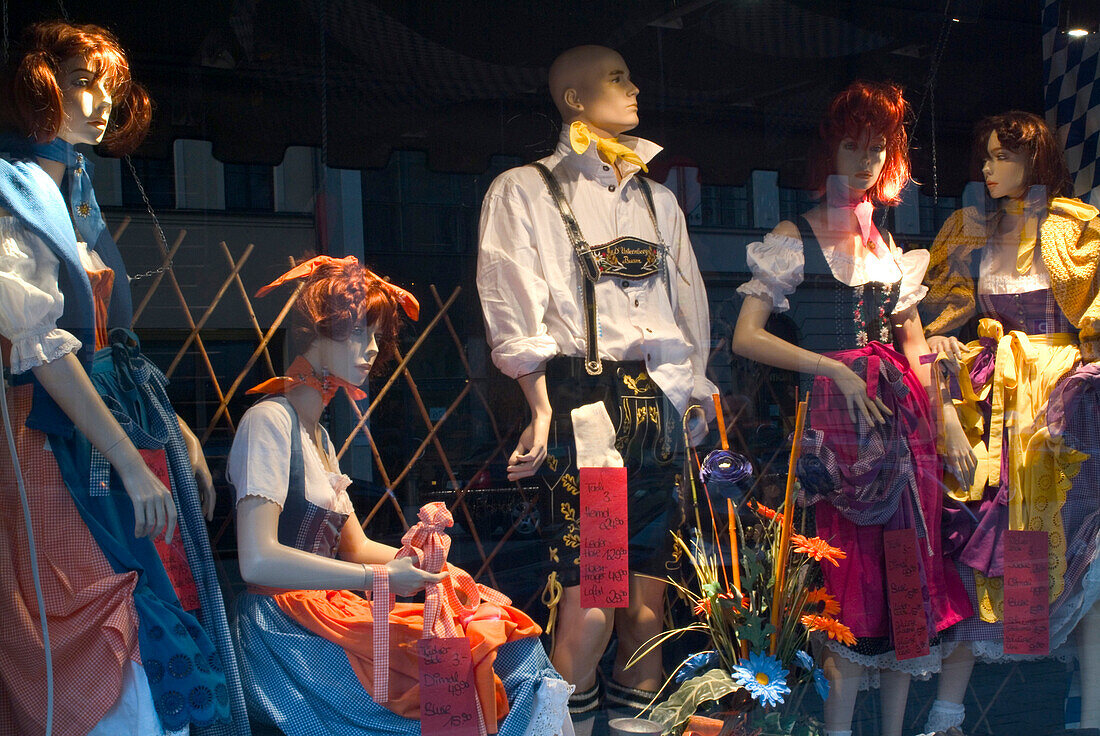 Traditional bavarian dresses in shop display, Dirndl and leather trousers, Munich, Bavaria, Germany