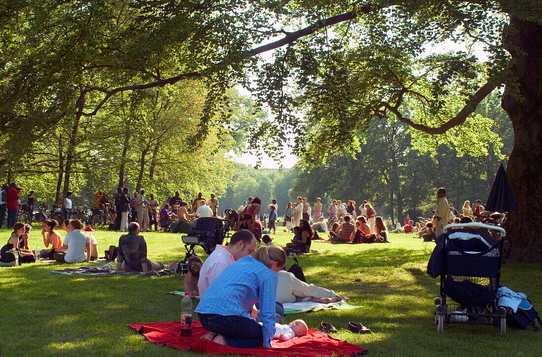 Sunday Picnic of young family on the green in the English Garden, Munich, Bavaria, Germany