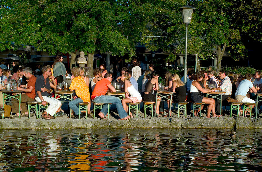 Young people in Seehaus Beergarden, English Garden, Munich, Bavaria, Germany