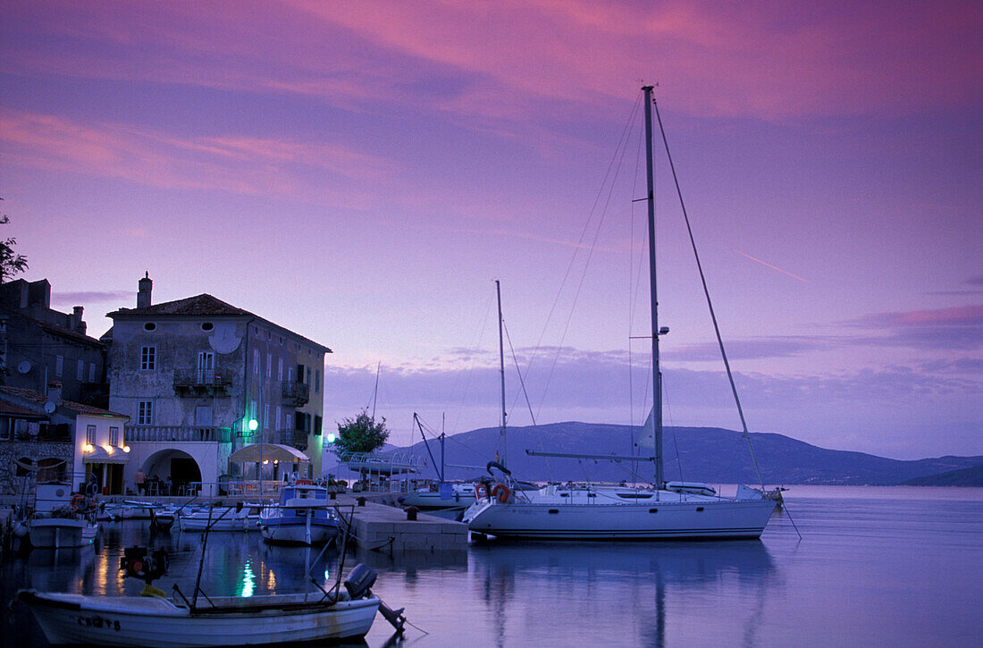 Boats in harbor in twilight, Valun, Cres island, Kvarner Gulf, Croatia