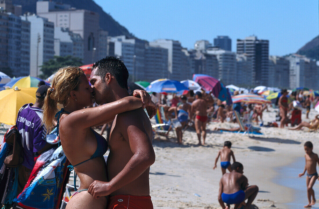 Kissing couple on the beach, Copacabana, Rio de Janeiro, Brazil, South America, America