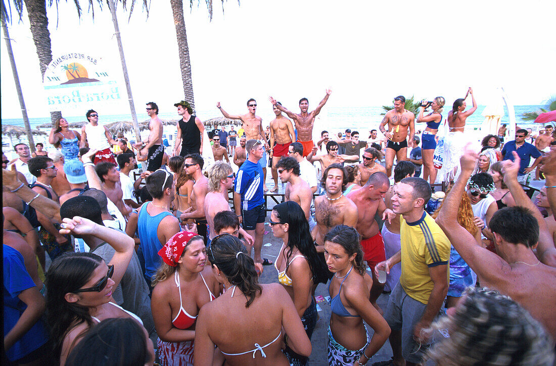 Young people dancing in the Bora Bora Beach Disco, Club, Playa d'en Bossa, Ibiza, Spain