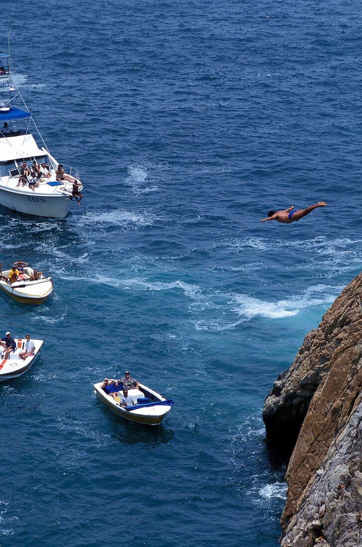 Cliff diver during jump, Acapulco, Guerrero, Mexico, America