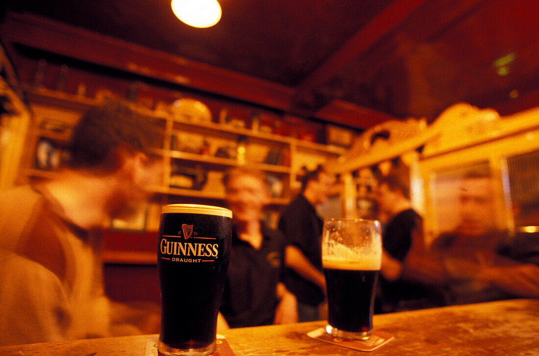 Glass of Guiness on the counter of O' Riadas Pub, Parliament Street, Kilkenny, Ireland, Europe