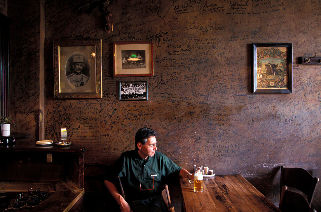 Man sitting in restaurant U Kalicha, Prague, Czech Republic