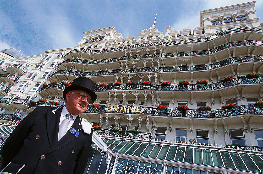 Concierge, portier in front of the Grand Hotel, Brighton, East Sussex, England, Great Britain