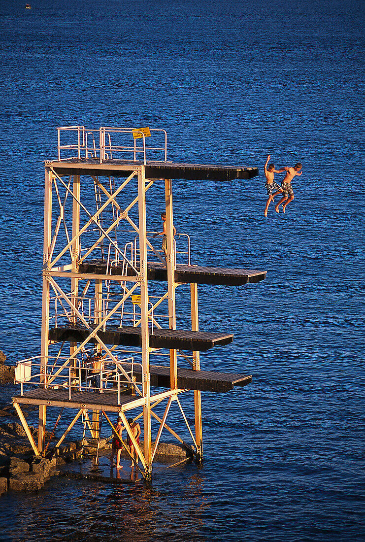 Jumping into Plymouth Sound, Plymouth, Devon, England