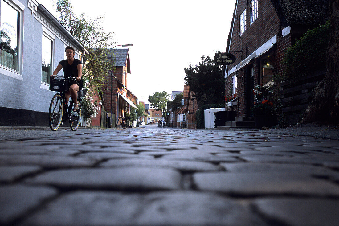 Cyclist on Cobblestone Street, Nordby, Fano, Denmark
