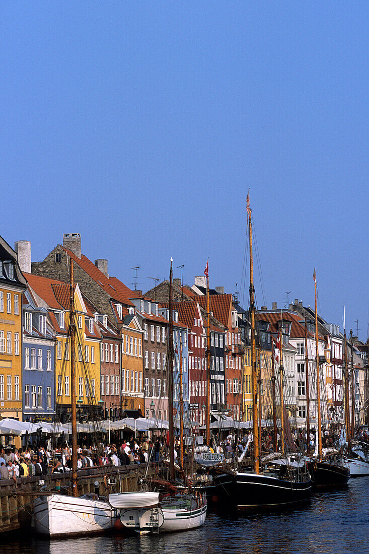 Old houses, boats and Cafés along the Nyhavn Canal, Copenhagen, Denmark
