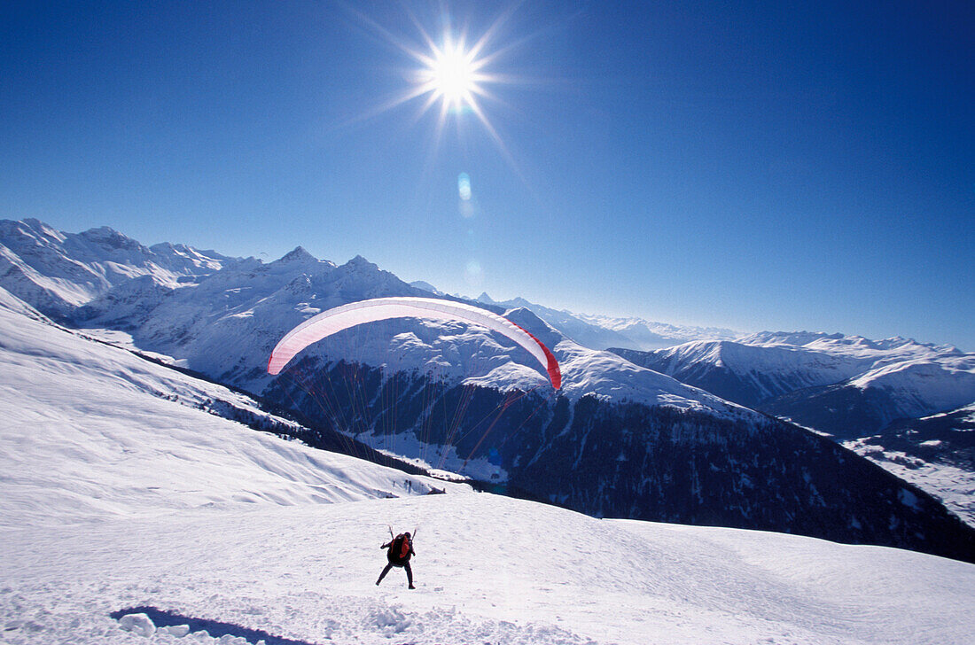 Paraglider at mount Jakobshorn, Davos, Grisons, Switzerland