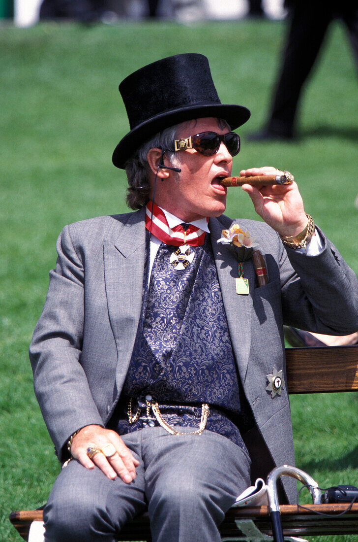 Man with top hat and cigar at a horse race in Epson, Surrey, Great Britain, Europe