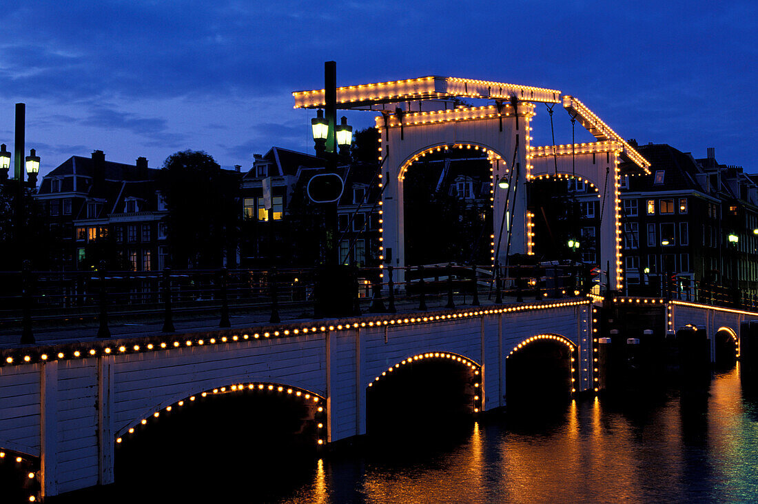 Magere Brug, Magere Bridge in the evening, drawbridge, Amstel river, Amsterdam, Netherlands