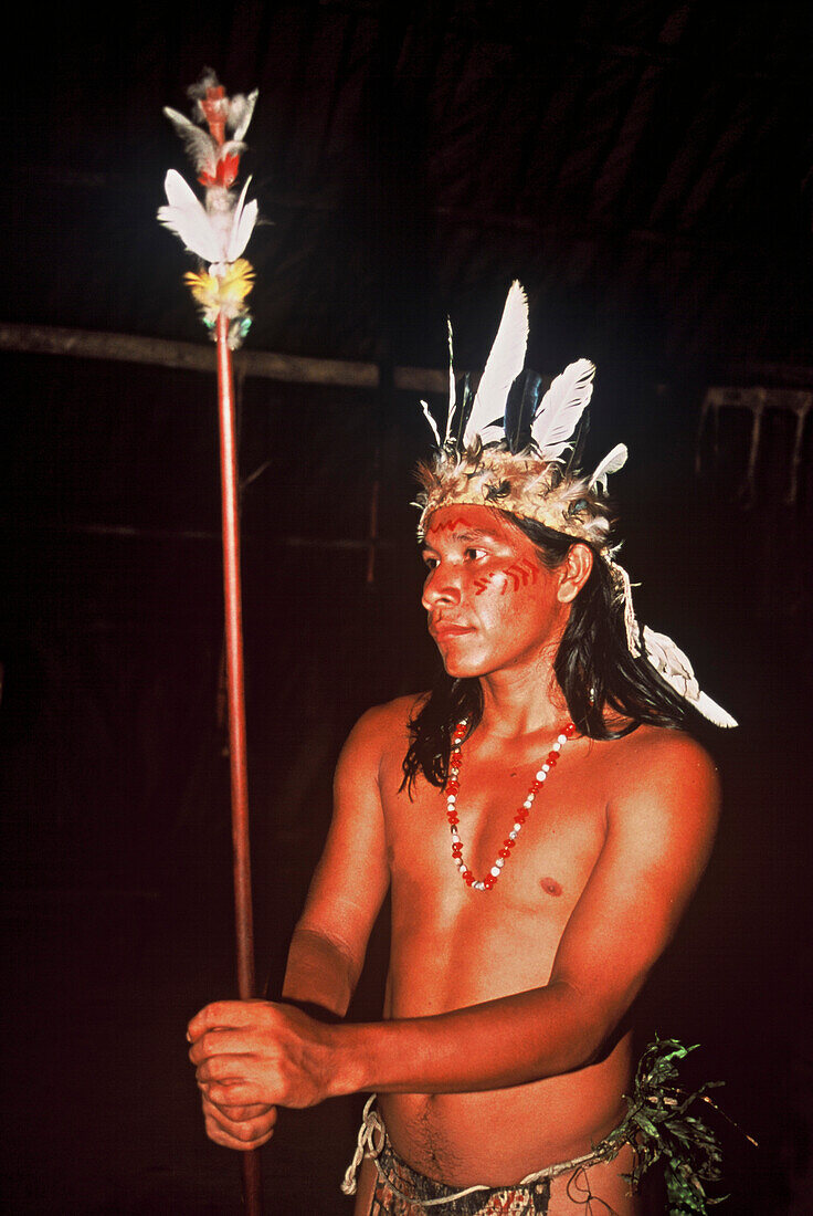 One young man with feather decorations and facial painting, Native South American Tarianos, Amazonas, Brazil