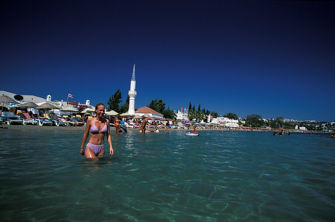 Young woman in water, Camel Beach, Bitez, Bodrum, Turkey