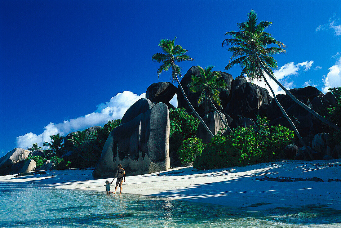 Mother and daughter on the beach, Anse Source d´Argent, La Digue, Seychelles, Indian Ocean