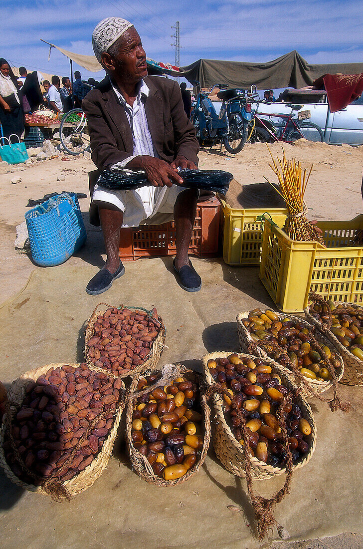 Local man selling dates on the market, Tozeur market, Tunesia