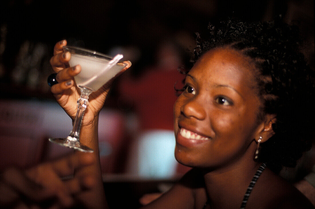 Young woman with Daiquiri Drink at a bar, El Floridita, Havana, Cuba, Caribbean, America